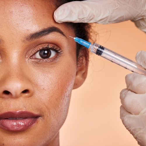 Black woman, botox cosmetics injection and beauty, facial aesthetics and collagen, wellness and ski.